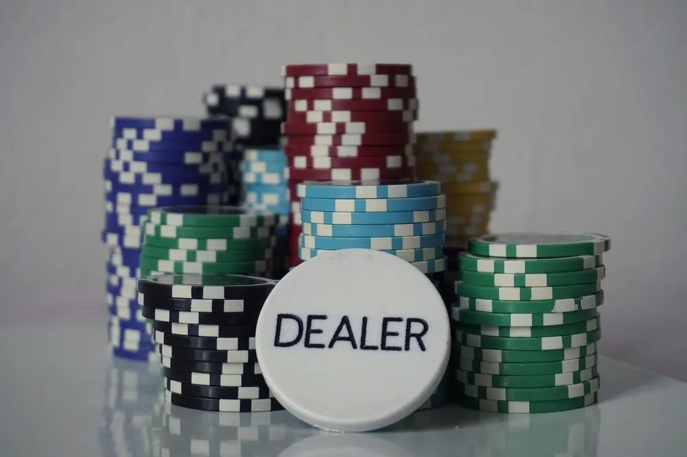 crypto gambling blackjack - poker chips and a dealer button
