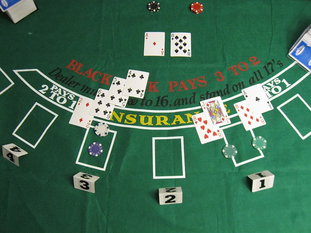 ghanaian online casino - blackjack hand on felt