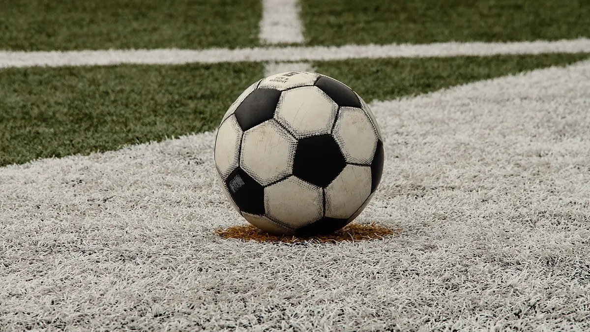 Football on a pitch - how to bet on sports and win