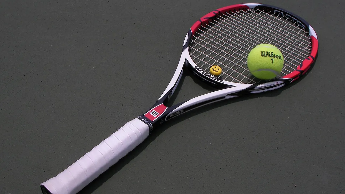 Tennis racket and balls - how to bet on wimbledon from ghana